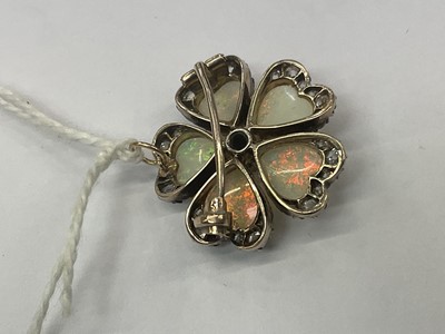 Lot 476 - Late Victorian opal and diamond flower brooch in the form of a pansy, with five heart shaped opal petals and old cut diamonds in silver and gold setting, 24mm.