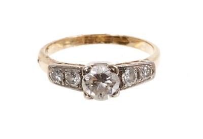 Lot 480 - Art Deco diamond ring with a brilliant cut diamond estimated to weigh approximately 0.60cts flanked by four further diamonds to the platinum shoulders on 28ct gold shank, ring size L.