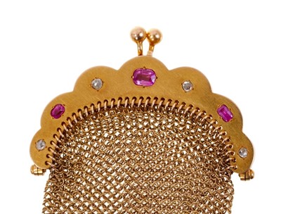 Lot 481 - Late 19th century French gold ruby and diamond purse with three oval mixed cut rubies and four rose cut diamonds and gold chain mail links, French eagle's head control marks, 90mm.