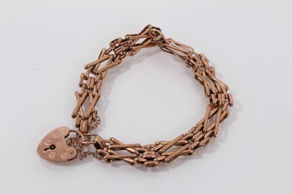 Lot 483 - Edwardian style 9ct rose gold gate bracelet with padlock clasp, 19cm.