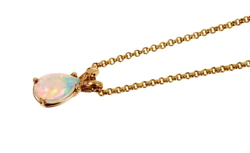 Lot 486 - Opal pendant with a pear shape cabochon opal measuring approximately 9.2mm x 6.1mm in 9ct gold setting on 9ct gold chain.