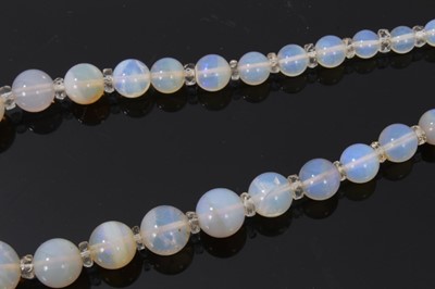 Lot 491 - Antique opal bead necklace with a string of graduated opal beads measuring 13.5mm - 2.8mm with faceted crystal spacers, 45cm.