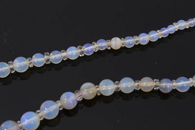 Lot 491 - Antique opal bead necklace with a string of graduated opal beads measuring 13.5mm - 2.8mm with faceted crystal spacers, 45cm.