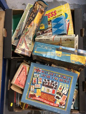 Lot 74 - Group of vintage toys to include one box of mixed games, one box of model kits, one box of assembled models and one box of model trains and tanks