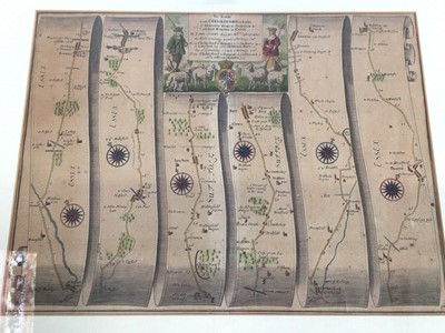 Lot 875 - John Ogilby, two 18th century hand-coloured road maps, London to Harwich and Chelmsford to Bury St Edmunds and Saffron Walden, each 32 x 43cm, in glazed frames