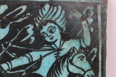 Lot 124 - Large Islamic turquoise tin glazed pottery tile with an equestrian scene, 24.5cm x 25cm