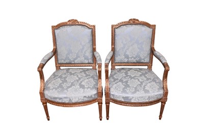 Lot 1423 - Pair of Louis XVI style carved giltwood fauteuil, each with duck egg satin upholstery within ribbon carved showwood frame on fluted legs