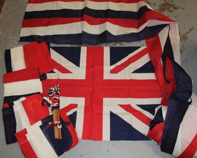 Lot 691 - 1950sb large linen Union Jack flag, stamped British Made 84 cm x 114 cm, similar large linen red white and blue street / balcony banners 70 cm x 850cm (1), 70cm x 400 cm (1), 70cm x 200 cm (4). Plu...