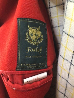 Lot 928 - Gentleman's red hunt coat by Foxley with brass Essex Hunt buttons, size 46