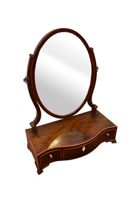 Lot 1461 - George III mahogany serpentine toilet mirror, with oval swing plate and three boxwood strung drawers to the base on cabriole legs, 43cm wide