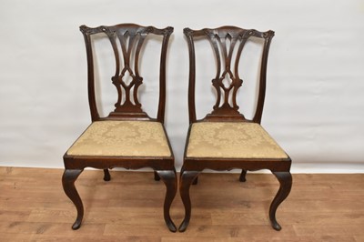 Lot 1469 - Pair of 18th century Continental fruitwood side chairs, each with carved pierced vase shaped splat and slip in seat on angular cabriole legs