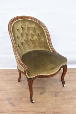 Lot 1472 - Early Victorian button upholstered tub chair, with carved showwood frame on cabriole legs and castors