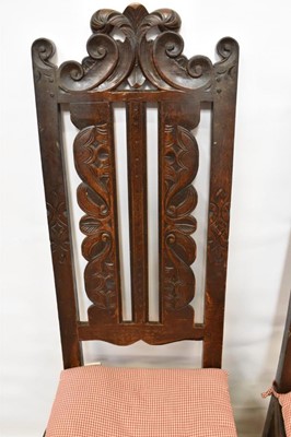 Lot 1479 - Set of four 17th century carved oak high dining chairs, each with pierced top rails and vertical splats, solid seat on turned and block under structure