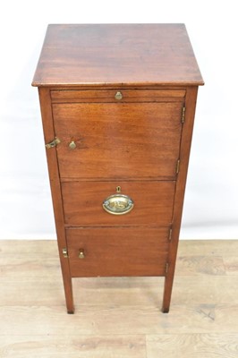 Lot 1483 - Regency mahogany narrow bedside table, with candle slide and two cupboards and drawer to the front raised on square tapered legs, 35cm wide x 30cm deep x 87cm high