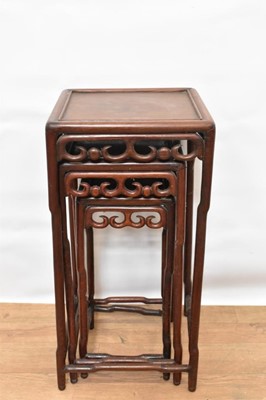 Lot 1487 - Nest of three Chinese hardwood side tables, each with pierced frieze, the largest 32cm wide