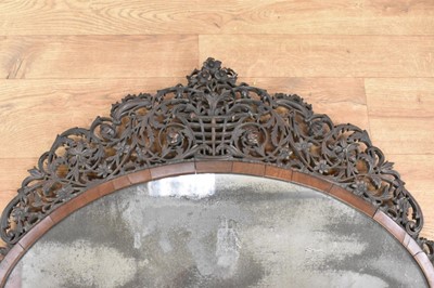 Lot 1488 - Fine 18th century Colonial hardwood wall mirror, with pleasantly distressed oval plate in cushion frame with ornate pierced surround, 77 x 78cm