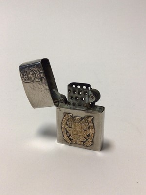 Lot 45 - Peruvian hammered silver lighter with applied  Inca motifs