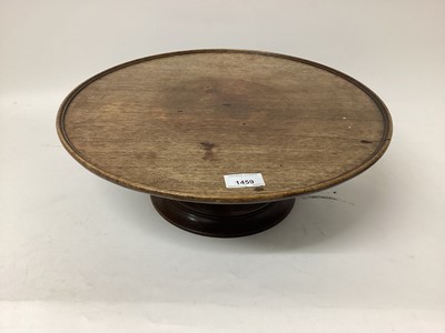 Lot 1459 - Antique mahogany lazy Susan, circular dished revolving top on bird cage and spread base, 42.5cm diameter