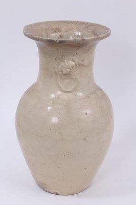 Lot 132 - Antique Chinese cream glazed stoneware vase, Qing or earlier, of baluster form with moulded mask and ring decoration, 31.5cm high