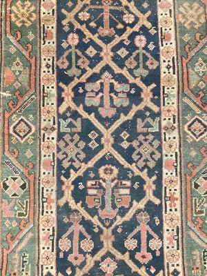 Lot 1504 - Antique West Persian runner, with angular knot work on midnight blue ground, in main meander border, 540 x 93cm