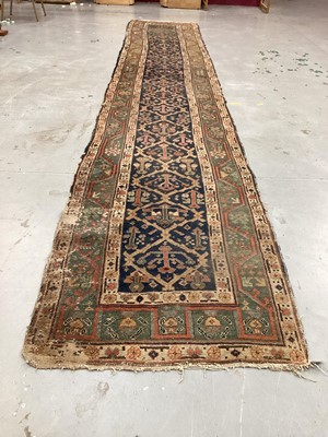 Lot 1504 - Antique West Persian runner, with angular knot work on midnight blue ground, in main meander border, 540 x 93cm