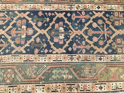 Lot 1504 - Antique West Persian runner, with angular knot work on midnight blue ground, in main meander border, 540 x 93cm