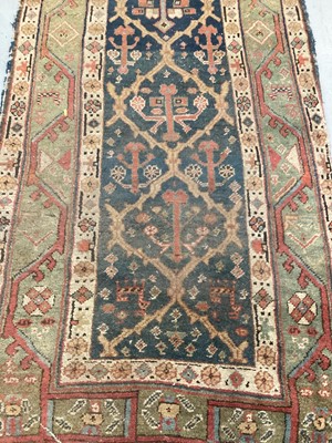 Lot 1504 - Antique West Persian runner, with angular knot work on midnight blue ground, in main meander border, 540 x 93cm