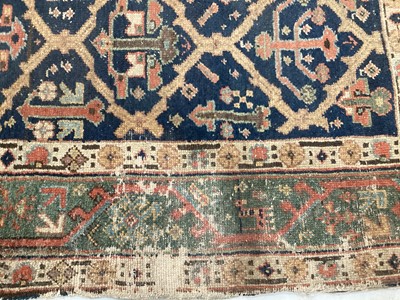 Lot 1504 - Antique West Persian runner, with angular knot work on midnight blue ground, in main meander border, 540 x 93cm