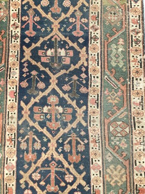 Lot 1504 - Antique West Persian runner, with angular knot work on midnight blue ground, in main meander border, 540 x 93cm