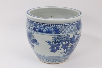 Lot 135 - 19th century Chinese blue and white porcelain jardinière, decorated with birds and flowers, the bottom with a border of stylised waves, the top with a border of flowers on a diaper ground, 25.5cm h...