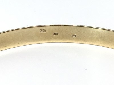 Lot 6 - French 14ct gold bangle with engraved geometric line decoration