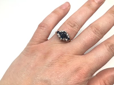 Lot 9 - 18ct gold sapphire and diamond cluster ring