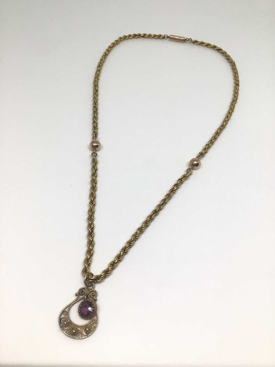 Lot 18 - Dutch gold rope twist chain with an amethyst and filigree pendant