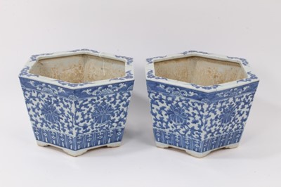 Lot 145 - A pair of 19th century Chinese blue and white porcelain jardinières, of hexagonal form, decorated with floral patterns, 17cm high x 27cm at widest point