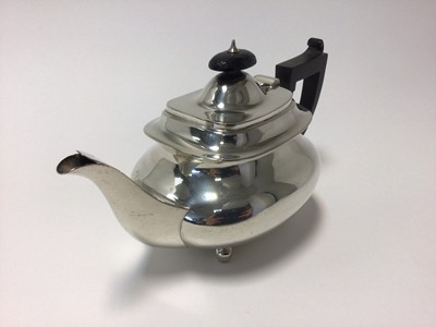 Lot 20 - George V sterling silver teapot, with ebony handle and knop, raised on ball feet, 24cm from spout to handle, Sheffield 1928 (Brook & Son), 19.5 oz