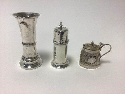Lot 21 - George V sterling silver lighthouse caster, with reeded decoration, Birmingham 1915, 10cm high, 1.8 oz, together with a filled silver spill vase of waisted form and an Indian white metal mustard wi...