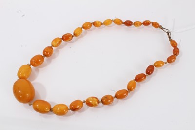 Lot 672 - Antique amber bead necklace with a string of graduated butterscotch amber beads