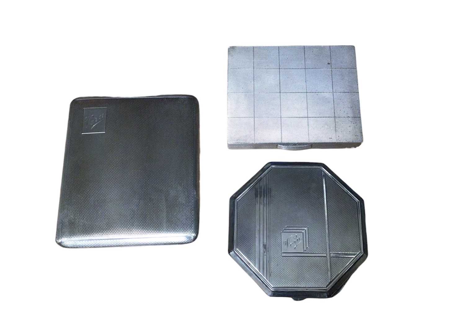 Lot 25 - 1930s silver octagonal powder compact, 1930s silver cigarette case with square engine turned decoration and one other silver cigarette case (3)