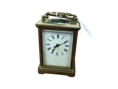 Lot 76 - Brass cased carriage clock and key