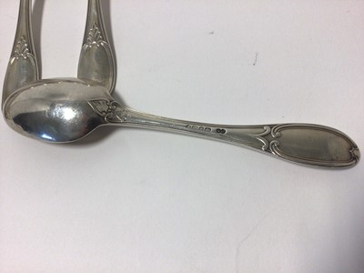 Lot 61 - A set of twelve matching Victorian and Edwardian silver forks and spoons, scrollwork patterns, 18cm long, various hallmarks, 26.4oz total weight