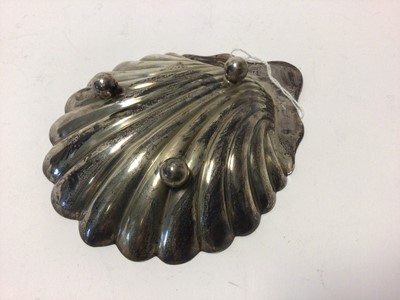 Lot 65 - A silver scallop shell dish on three ball feet, 13cm long, Sheffield 1900