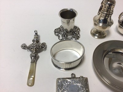 Lot 75 - Group of sterling and continental silver, including a vesta case, a small dish, miniature jug, caster, candle holder, a needle case and a baby's rattle, total weight 5.9oz