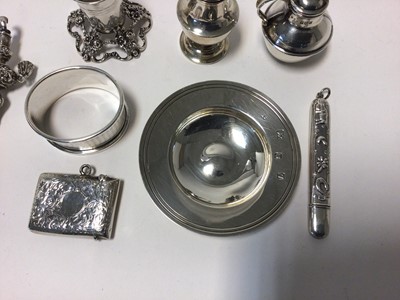 Lot 75 - Group of sterling and continental silver, including a vesta case, a small dish, miniature jug, caster, candle holder, a needle case and a baby's rattle, total weight 5.9oz