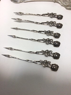 Lot 76 - Scottish silver loving spoon in case, other silver flatware, and a set of six silver cocktail sticks marked 835