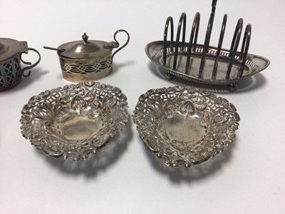 Lot 84 - Group of silver and silver plate, including a toast rack, a pair of pierced dishes on three ball feet, mustard, napkin rings, etc (6.5 oz of silver)