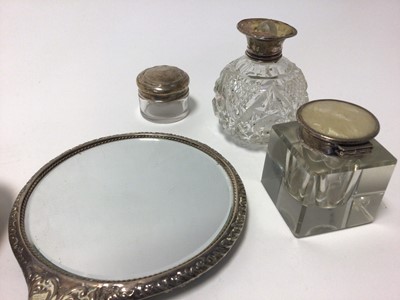 Lot 85 - Group of silver, including a pair of sterling weighted candlesticks, three silver-topped glass items, and a four-piece brush and comb set