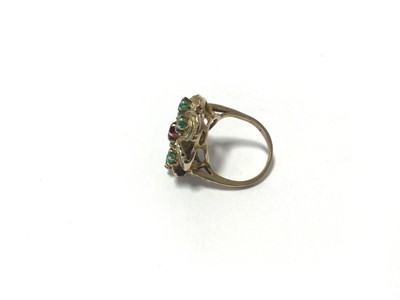 Lot 94 - 18ct gold emerald and ruby flower head ring