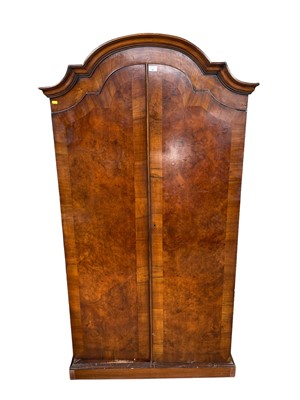 Lot 81 - 1930s walnut dome topped wardrobe on plinth