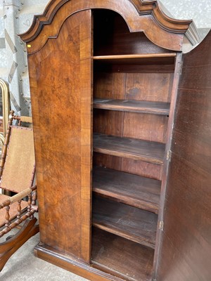 Lot 81 - 1930s walnut dome topped wardrobe on plinth