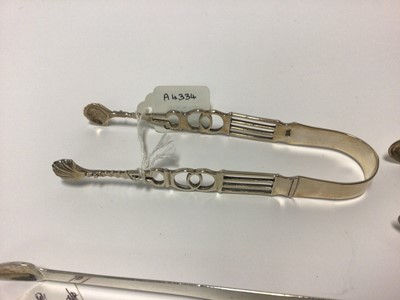 Lot 62 - Ten pairs of Georgian and Victorian silver sugar tongs, including Exeter and Dublin hallmarks, 14.4oz total weight